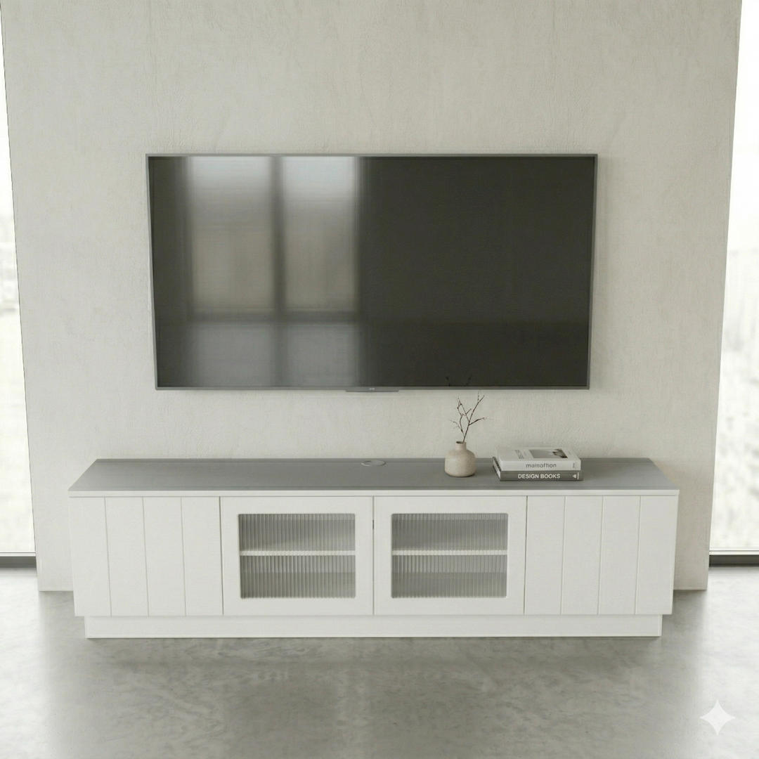 Modern living room with a flat-screen TV mounted on the wall above a white entertainment console.